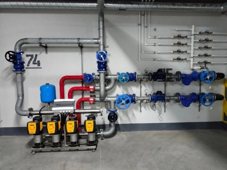 Installed pumping station with manifolds and valves
